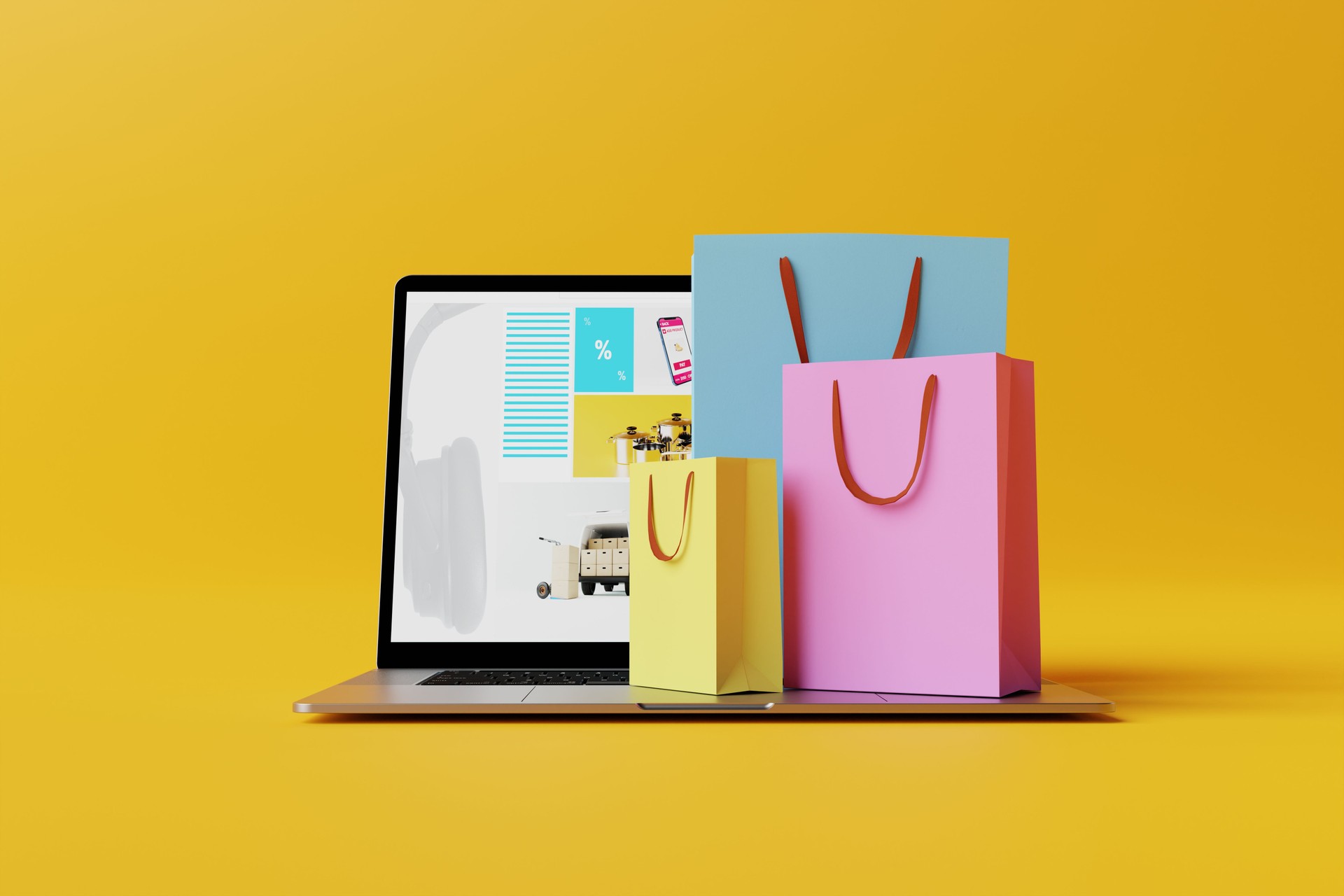 Laptop with the website of the online store and shopping bags.